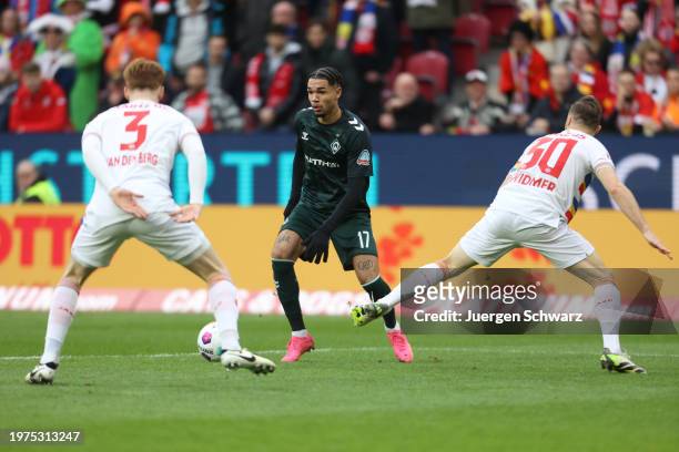 Justin Njinmah of Bremen in action against Sepp van den Berg of Mainz during the Bundesliga match between 1. FSV Mainz 05 and SV Werder Bremen at...