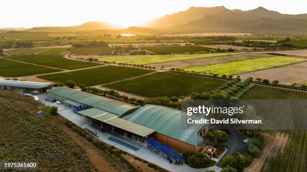 General aerial view of the Graham Beck Estate winery and surrounding vineyards at sunset on January 24, 2024 near Robertson in South Africa's Western...