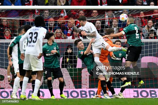 Freiburg's German defender Lukas Kuebler heads the ball to score the team's first goal during the German first division Bundesliga football match SC...
