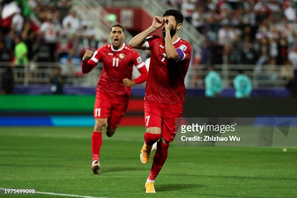Omar Khrbin of Syria celebrates his goal during the AFC Asian Cup Round of 16 match between Iran and Syria at Abdullah Bin Khalifa Stadium on January...
