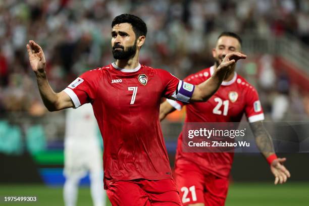 Omar Khrbin of Syria celebrates his goal during the AFC Asian Cup Round of 16 match between Iran and Syria at Abdullah Bin Khalifa Stadium on January...