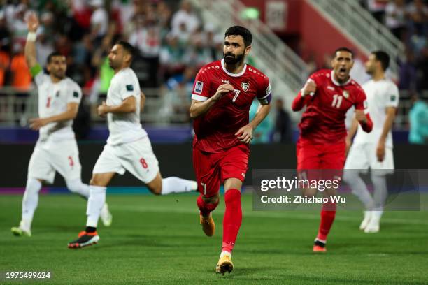 Omar Khrbin of Syria celebrates his goal during the AFC Asian Cup Round of 16 match between Iran and Syria at Abdullah Bin Khalifa Stadium on January...