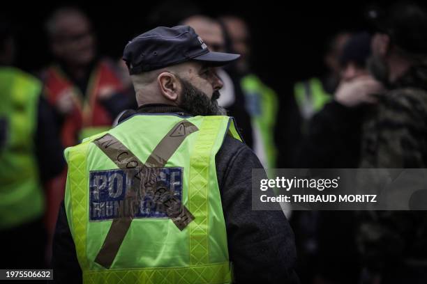 Municipal police officer wears a police jersey with a duct tape cross reading "angry" as he takes part in a demonstration in Bordeaux, France, on...
