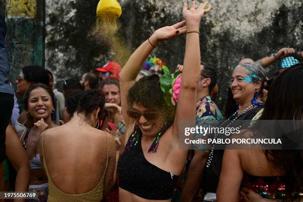 Revellers take part in the "Ceu a Terra" street carnival "bloco" group parade at the Santa Teresa neighborhood in Rio de Janeiro, Brazil on February...