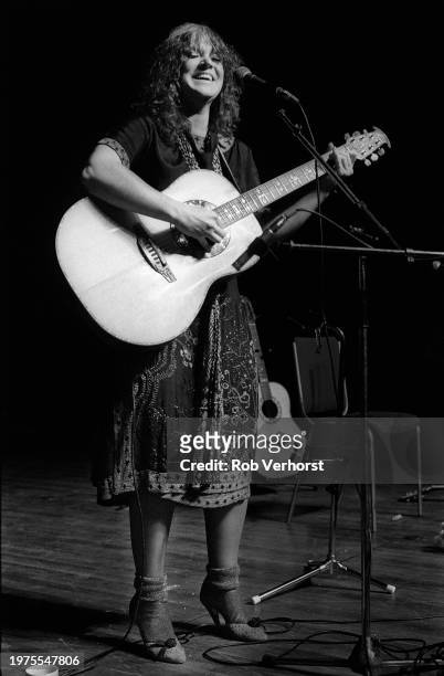 Melanie performs on stage at Folk Festival, de Doelen, Rotterdam, Netherlands, 4th September 1982. She is playing an Ovation acoustic guitar.
