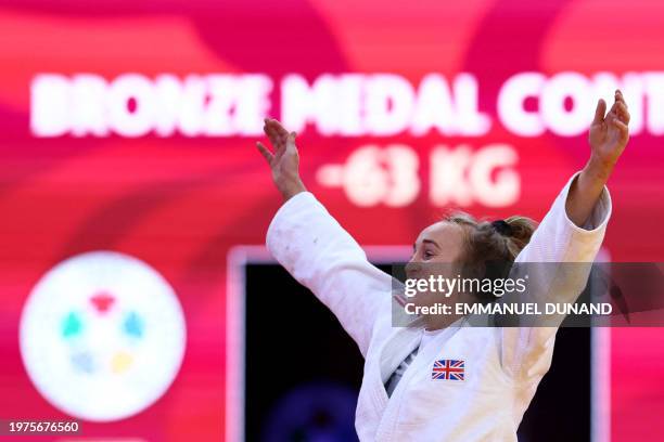 Britain's Lucy Renshall celebrates after winning against Netherlands' Joanne van Lieshout in the women's -63kg bronze medal bout during the Paris...