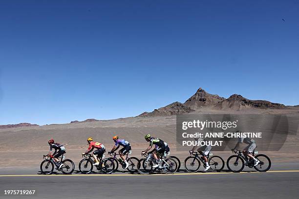 The pack rides during the fifth stage of the AlUla Tour cycling race, between Alula Old Town and Skyviews of Harrat Uwayrid on February 3, 2024.