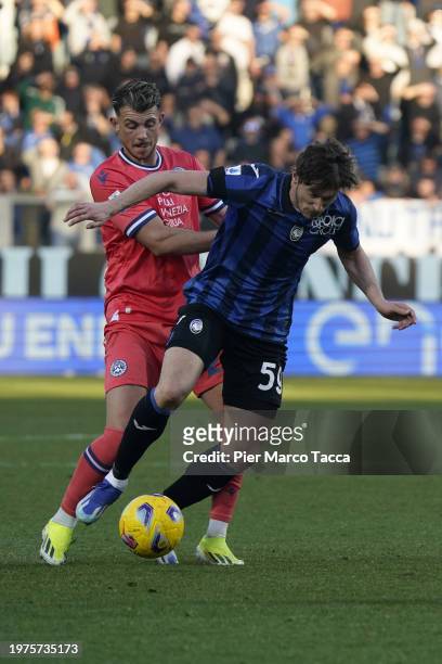 Lazar Samardzic of Udinese Calcio competes for the ball with Aleksey Miranchuk of Atalanta BC during the Serie A TIM match between Atalanta BC and...