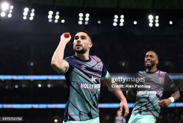 Neal Maupay of Brentford celebrates scoring his team's first goal during the Premier League match between Tottenham Hotspur and Brentford FC at...