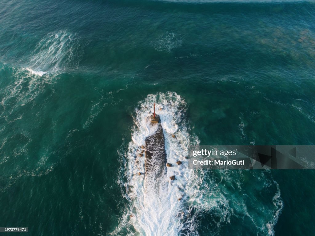 Breakwater with lighthouse from above