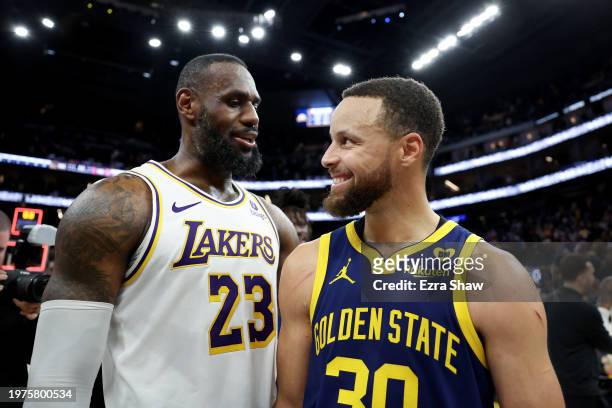 LeBron James of the Los Angeles Lakers and Stephen Curry of the Golden State Warriors talk to each other after the Lakers beat the Warriors in double...