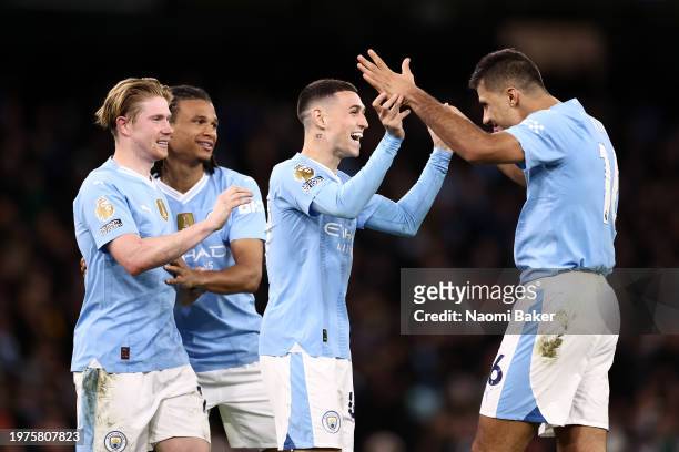 Rodri of Manchester City celebrates scoring his team's third goal with Phil Foden, Kevin De Bruyne and Nathan Ake during the Premier League match...