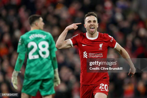 Diogo Jota of Liverpool celebrates scoring his team's first goal during the Premier League match between Liverpool FC and Chelsea FC at Anfield on...