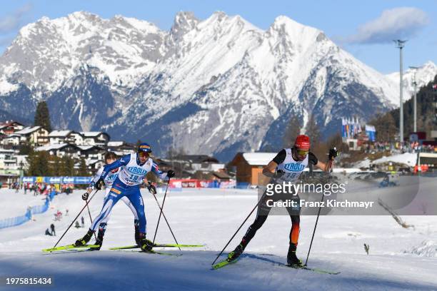 Ilkka Herola of Finland and Johannes Rydzek of Germany competes during the Men's Gundersen Large Hill HS 109/10 km at the Viesmann FIS Nordic...