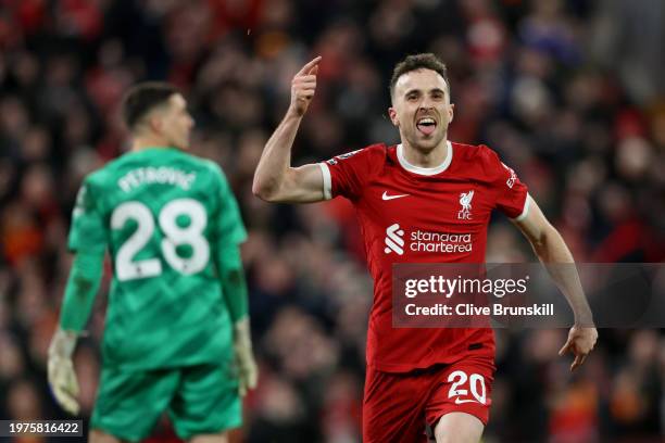 Diogo Jota of Liverpool celebrates scoring his team's first goal during the Premier League match between Liverpool FC and Chelsea FC at Anfield on...