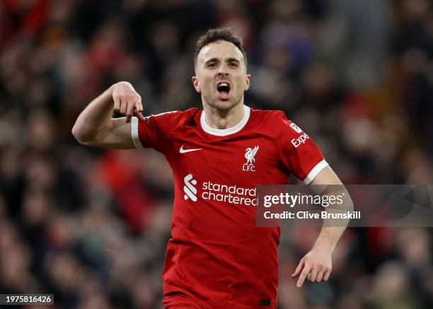 Diogo Jota of Liverpool celebrates scoring his team's first goal during the Premier League match between Liverpool FC and Chelsea FC at Anfield on...