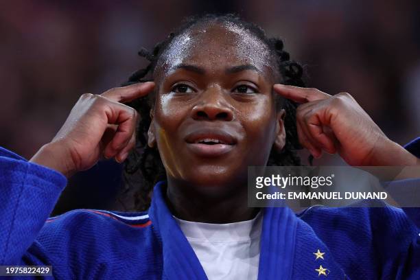 France's Clarisse Agbegnenou celebrates after winning against Croatia's Katarina Kristo in the women's -63kg final bout during the Paris Grand Slam...