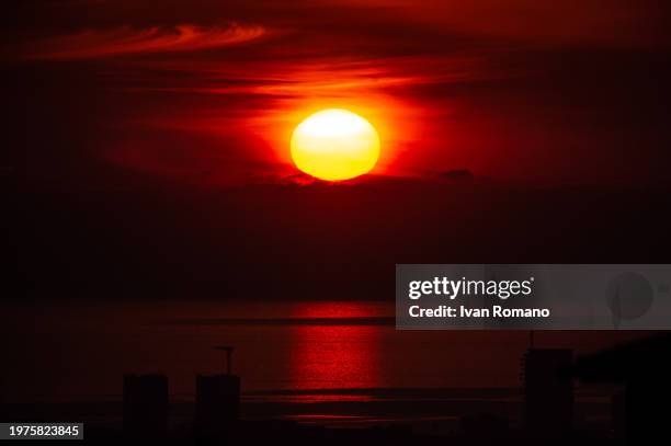 The sun sets on the Mediterranean Sea in the Gulf of Salerno on January 25, 2024 in Pontecagnano Faiano, Italy.