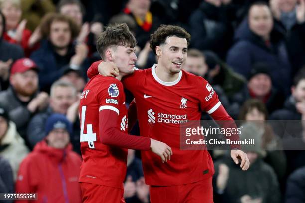 Conor Bradley of Liverpool celebrates scoring his team's second goal with Curtis Jones during the Premier League match between Liverpool FC and...