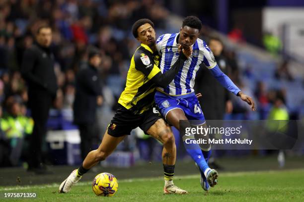 Jamal Lewis of Watford challenges Anthony Musaba of Sheffield Wednesday during the Sky Bet Championship match between Sheffield Wednesday and Watford...