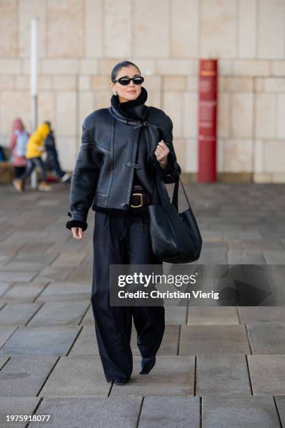 Darja Barannik wears black shearling jacket, pants, bag outside OpéraSport during the Copenhagen Fashion Week AW24 on January 31, 2024 in Copenhagen,...