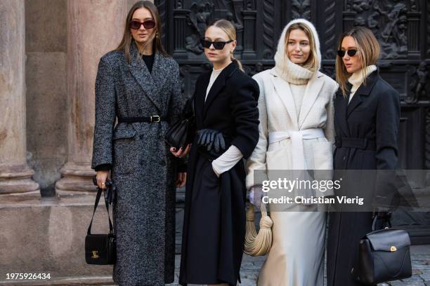 Guest wears grey belted wool coat, black gloves, Celine bag & a guest wears black coat, white socks, heels, belt & a guest wears creme white...