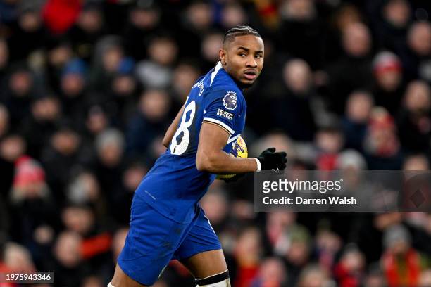 Christopher Nkunku of Chelsea celebrates scoring his team's first goal during the Premier League match between Liverpool FC and Chelsea FC at Anfield...