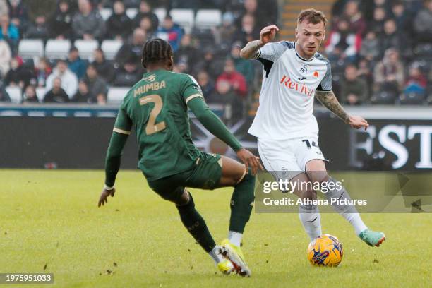 Bali Mumba of Plymouth Argyle and Josh Tymon of Swansea City in action during the Sky Bet Championship match between Swansea City and Plymouth Argyle...