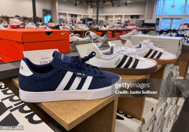 Adidas shoes are displayed at a DSW store on January 31, 2024 in Novato, California. German sportswear maker Adidas reported a better-than-expected...