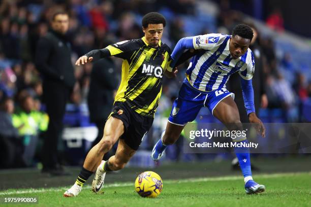 Jamal Lewis of Watford challenges Anthony Musaba of Sheffield Wednesday during the Sky Bet Championship match between Sheffield Wednesday and Watford...