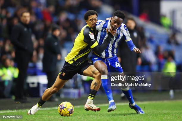 Jamal Lewis of Watford challenges Anthony Musaba of Sheffield Wednesday during the Sky Bet Championship match between Sheffield Wednesday and Watford...