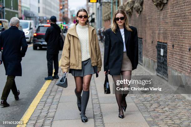 Mary L. Jean wears beige zipper jacket, grey mini skirt, tights, blue bag, knee high socks, creme white knit, sunglasses & Sophie Pirrung wears...