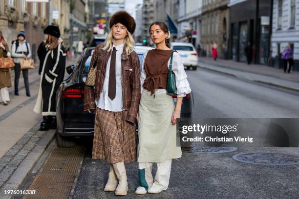 Guest wears brown fur hat outside The Garment during the Copenhagen Fashion Week AW24 on January 31, 2024 in Copenhagen, Denmark.