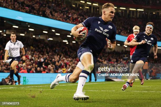 Scotland's wing Duhan van der Merwe runs with the ball to score a try during the Six Nations international rugby union match between Wales and...
