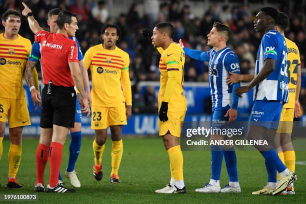 Spanish referee Martinez Munuera sends Barcelona's Brazilian forward Vitor Roque off the pitch after being presented two yellow cards during the...