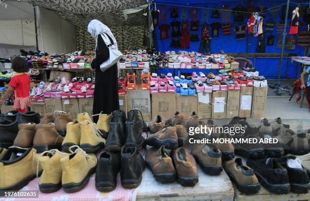 Shoes smuggled from Egypt via tunnels sit for sale at a street shop in Gaza City on June 22, 2010. AFP PHOTO/MOHAMMED ABED