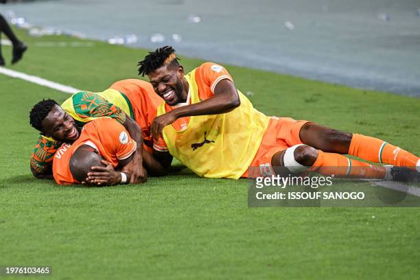 Ivory Coast's midfielder Seko Fofana celebrates with Ivory Coast's midfielder Ibrahim Sangare after the team's second goal during the Africa Cup of...
