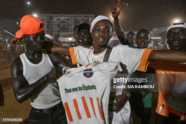 Ivory Coast's supporters celebrate the qualification after Ivory Coast won the Africa Cup of Nations 2024 quarter-final football match against Mali,...