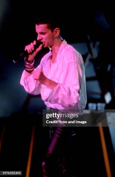 English musician Dave Gahan, of the English electronic music band Depeche Mode, sings on stage during the 1986 Black Celebration Tour at the Pine...