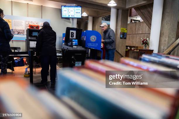 Voter casts a ballot on the first day of early voting for New York's 3rd Congressional District special election at the Port Washington Public...