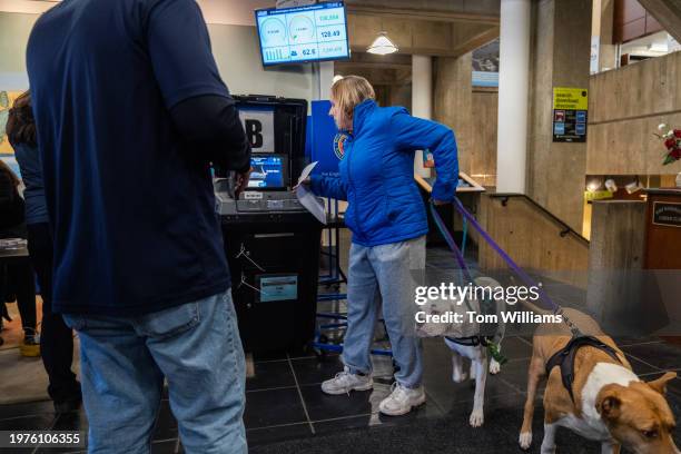 Voter casts a ballot on the first day of early voting for New York's 3rd Congressional District special election at the Port Washington Public...