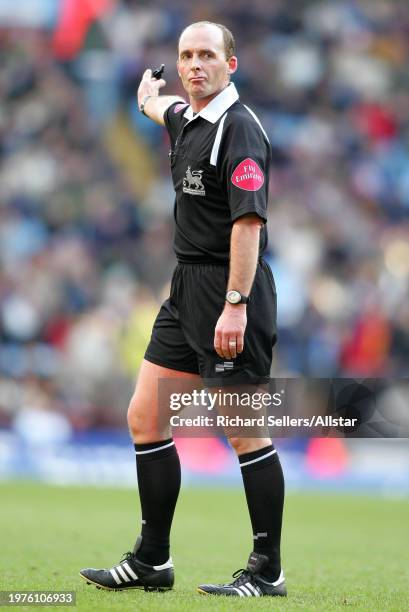 December 17: Mike Dean, Premiership Football Referee pointing during the Premier League match between Aston Villa and Manchester United at Villa Park...