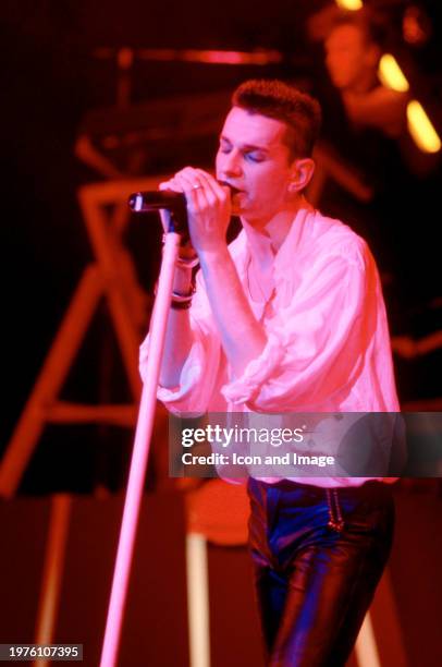 English musician Dave Gahan, of the English electronic music band Depeche Mode, sings on stage during the 1986 Black Celebration Tour at the Pine...