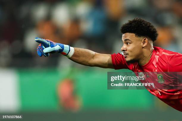 South Africa's goalkeeper Ronwen Williams celebrates after winning at the end of the Africa Cup of Nations 2024 quarter-final football match between...