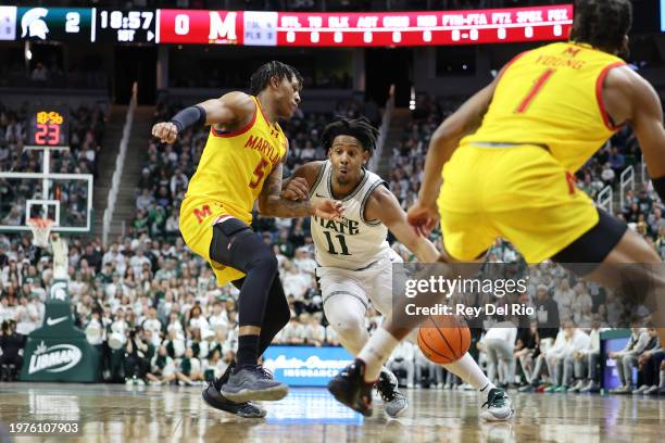 Hoggard of the Michigan State Spartans handles the ball while defended by DeShawn Harris-Smith of the Maryland Terrapins at Breslin Center on...