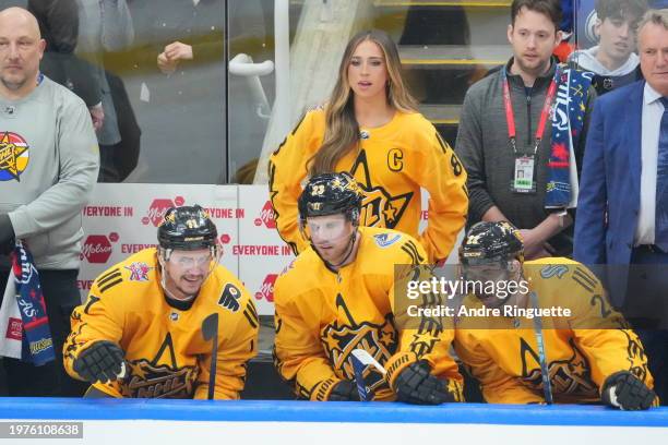 Tate McRae of Team MacKinnon looks on from the bench against Team McDavid during the 2024 Honda NHL All-Star Game at Scotiabank Arena on February 03,...