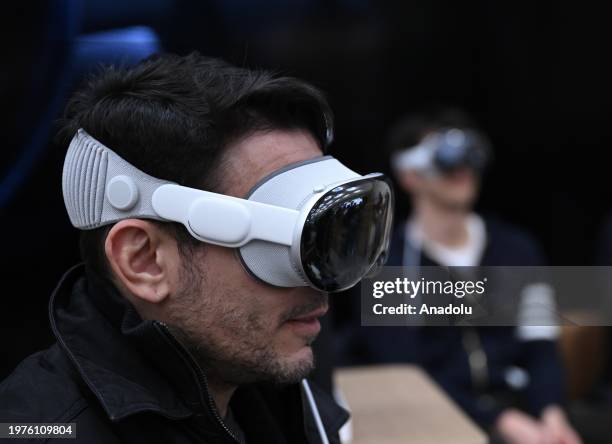 Customers check Apple Vision Pro mixed reality headset at Apple store in New York, United States on February 03, 2024.