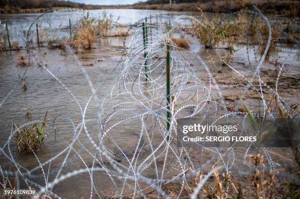Razor wire is seen near the Rio Grande at Shelby Park on February 3, 2024 in Eagle Pass, Texas. The park has been occupied by members of Texas...