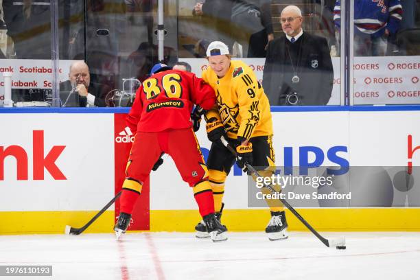 Nikita Kucherov of the Tampa Bay Lightning of Team Hughes warms up with Kirill Kaprizov of the Minnesota Wild of Team MacKinnon during the 2024 Honda...