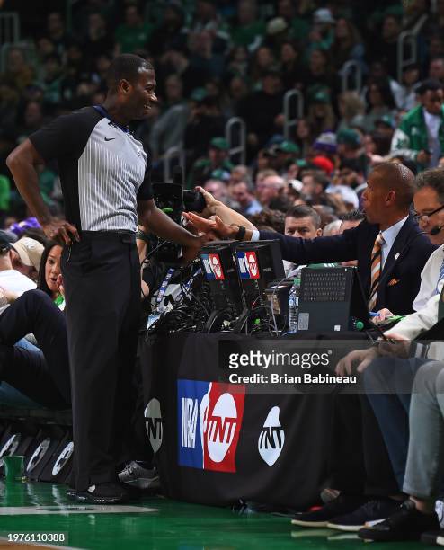 Referee James Williams talks to Reggie Miller during the game between the Los Angeles Lakers and Boston Celtics on February 1, 2024 at the TD Garden...